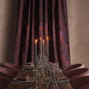 neutral botanical curtain with dining table and armchair