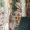green botanical curtain with armchair
