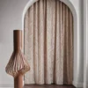 white geometric curtain with rug and vases