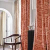 white misc curtain with chair and vases