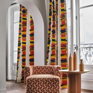 orange striped curtain with armchair and coffee table