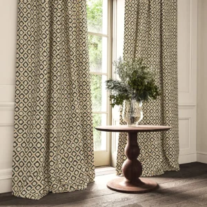black-grey checked curtain with cushion and vases
