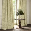 yellow traditional curtain with cushion and vases
