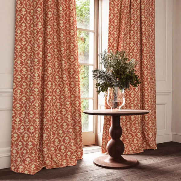 red traditional curtain with cushion and vases