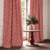 red traditional curtain with cushion and vases