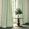 blue traditional curtain with cushion and vases
