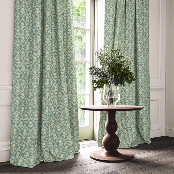 blue traditional curtain with cushion and vases