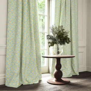 yellow botanical curtain with cushion and vases