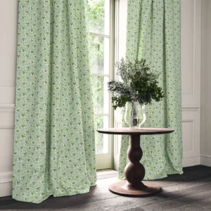 green botanical curtain with cushion and vases