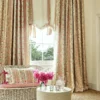 pink striped curtain with cushion and vases