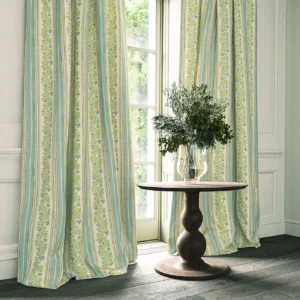blue striped curtain with cabinets and vases
