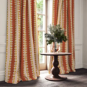 red striped curtain with cabinets and vases