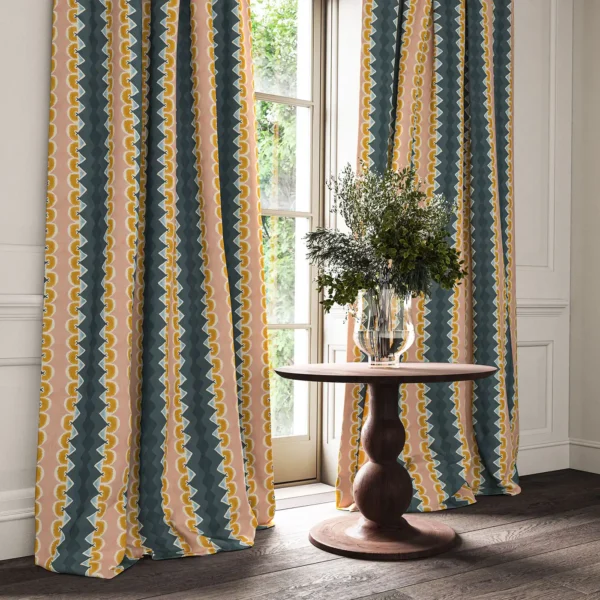 blue striped curtain with side table and vases