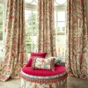 red animal curtain with pouf and cushion