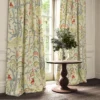 green animal curtain with pouf and cushion