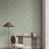 blue misc wallpaper and wall with side table and lamps