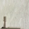 yellow botanical wallpaper and wall with coffee table and vases