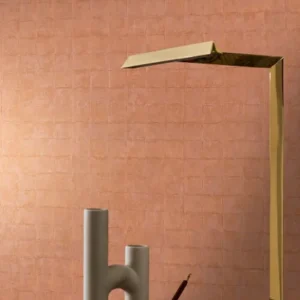 orange geometric wallpaper and wall with dining table and lamps