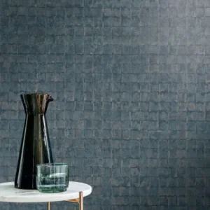blue geometric wallpaper and wall with side table and vases