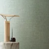 green geometric wallpaper and wall with lamps