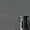 black-grey plain wallpaper and wall with side table and vases