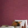 purple plain wallpaper and wall with pouf and cushion