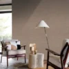 brown plain wallpaper and wall with armchair and side table