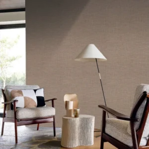 brown plain wallpaper and wall with armchair and side table