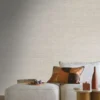 black-grey plain wallpaper and wall with pouf and side table