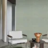 blue geometric wallpaper and wall with armchair and coffee table