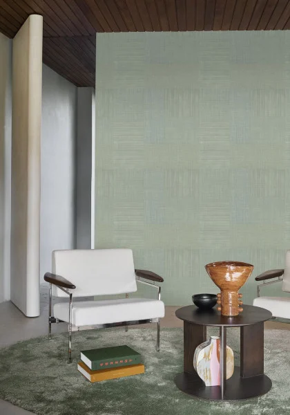 Mestizo Wallpaper - Cactus by blue geometric wallpaper and wall with armchair and coffee table