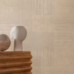 neutral geometric wallpaper and wall with side table and vases