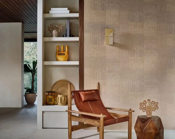 white geometric wallpaper and wall with armchair and vases