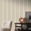 neutral striped wallpaper and wall with armchair and vases