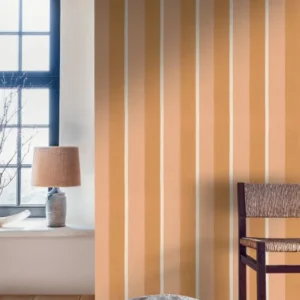 pink striped wallpaper and wall with chair and lamps