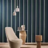 blue striped wallpaper and wall with armchair and lamps