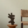 blue plain wallpaper and wall with chair and vases