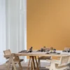 yellow plain wallpaper and wall with dining table and chair