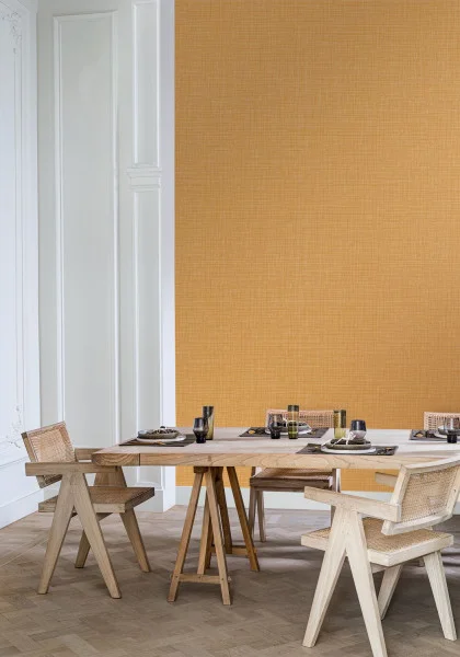 Sierra Wallpaper - Curry by yellow plain wallpaper and wall with dining table and chair
