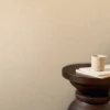 neutral plain wallpaper and wall with side table and vases
