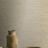 neutral plain wallpaper and wall with coffee table and vases