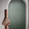 blue plain wallpaper and wall with vases