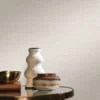 white plain wallpaper and wall with coffee table and vases