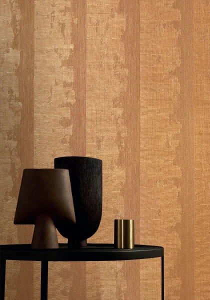 Nerikomi Wallpaper - Cuivre by orange striped wallpaper and wall with coffee table and vases