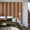 brown striped wallpaper and wall with bed and coffee table