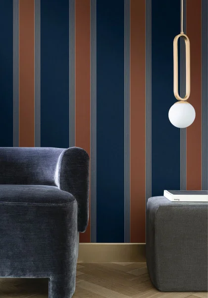 Auteuil Wallpaper - Marine / Rouille by blue striped wallpaper and wall with armchair and lamps