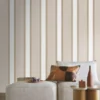 neutral striped wallpaper and wall with armchair and cushion