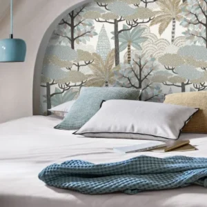 blue botanical wallpaper and wall with bed and cushion