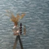 blue contemporary wallpaper and wall with side table and vases