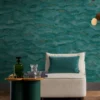 blue contemporary wallpaper and wall with armchair and coffee table